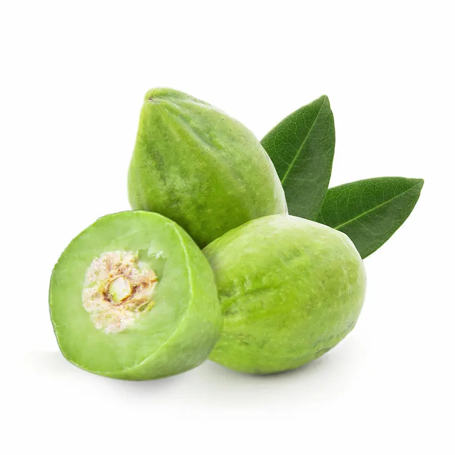 Green fruits with leaves on a white background